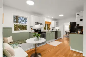 Spacious kitchen includes corner dining nook with ample storage.