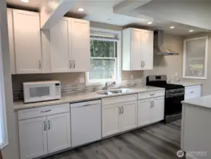 New kitchen with Quartz Counters. #2835 Cooper Point Rd NW, Olympia, WA 98502