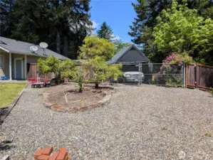 Fully enced back yard with gravel pathways and parking. #2835 Cooper Point Rd NW, Olympia, WA 98502