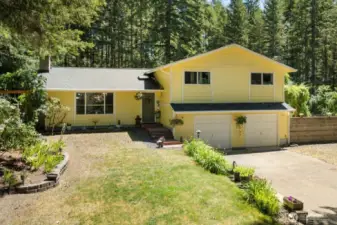 Tucked among the trees and open skies, this storybook home is ready to welcome you with space, charm, and quiet confidence.