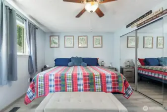 Spacious and serene, the primary bedroom offers a quiet escape with soft light and a calming layout.