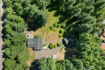 Surrounded by tall evergreens on all sides, this 2 acre property offers true privacy, space, and serenity.