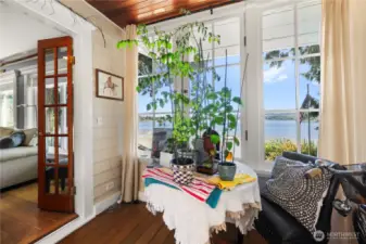 This sunroom off the living room would also make a perfect office space!