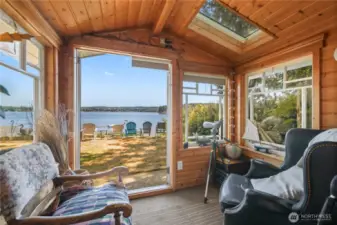 Small little nook from the lower level family room. French doors leading out to the yard. Picture yourself curled up on a chair with a good book and a cup of coffee watching the sunrise.