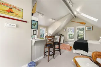 Vaulted ceilings and large skylights create a sense of spaciousness while bringing in an abundant of natural light. Ideal as a guest suite, rental opportunity, or home office!