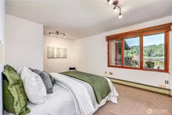 Lower level bedroom with views of water