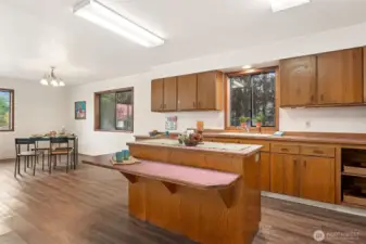 Watch the seasons change, your garden grow or life go by from the kitchen window.  This interactive kitchen adjacent to the living space offers the open feel so popular in current new construction.  Ne walls to open up!