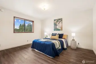 Discover a restful primary suite with 3/4 bath at the back corner of the home.  Find space for a King Size bed, or plenty of bedroom furnishings, even set up a bunk room in this generous space!