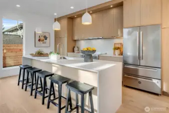 Massive island opens to the dining area.