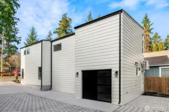 Private garage and parking pad - or can be used as a 3rd patio