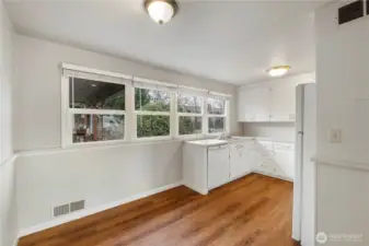 Another look from front of Dining Room into Kitchen w/4 side by side bank of windows & dishwasher/sink