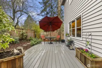 This spacious and sunny front deck is just one of multiple outdoor spaces waiting to be enjoyed.