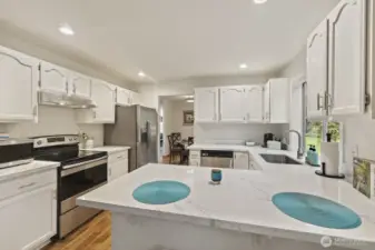 Stainless steel appliances, bar seats and abundant storage make this space a true joy.