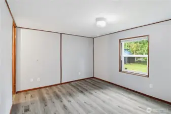 Second bedroom, looking to the front of the property.