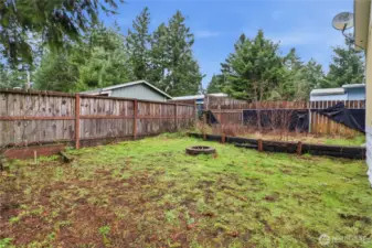 Backyard, fenced, plenty of room to entertain, relax, garden.