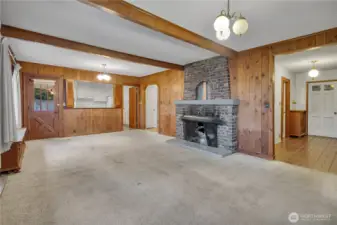 Main home... lovely spacious living room with beamed ceilings