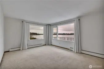 Main Home... family room with amazing views of Mt Rainier and the lake