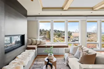 Clean lines meet cozy luxury. Bask in the warm lighting provided by the expansive floor the ceiling windows, or relax by the linear fireplace with ceiling high steel paneling.