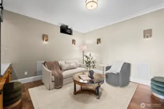 Whether hosting a big-game viewing party or a quiet family movie marathon, this sophisticated media sanctuary serves as the home’s premier entertainment destination