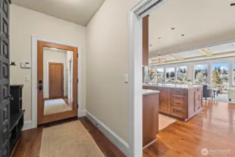 Find ease in organizational inquiries with this beautiful mudroom located behind the kitchen, paired with two closets located on either side.