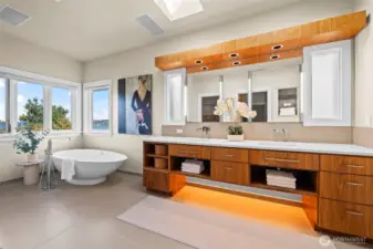 Luxury is in the details. The integrated vanity lighting and sophisticated free-standing tub adds a layer of contemporary depth to the suite, creating a serene ambiance that rivals the finest five-star resorts.