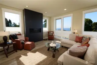 Living room with gas fireplace and sound views