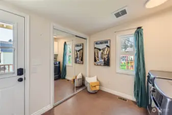 Large laundry room with mirrored closet. Door to back deck. Parking driveway off of back alley.