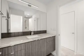 Master Suite Bathroom with granite and modern cabinetry.