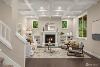 The living room is absolutely beautiful with coffered ceilings, built-in shelves and plenty of windows.