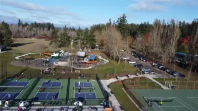 Battle Point Park with a lake, new playground, playing fields, an observatory, tennis and pickleball courts, bike park, fruit trees and ++++