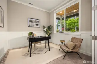 The front room is an office space overlooking the front yard.