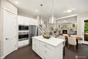 To the left is a walk-in pantry. Wolf wall oven and microwave and large refrigerator. The island provides plenty of storage.