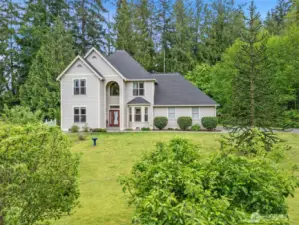 Lush natural surroundings and fruit trees.