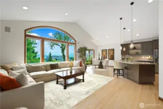Family room is accented with an impressive wall of windows.  Portions of this photo are virtually staged.