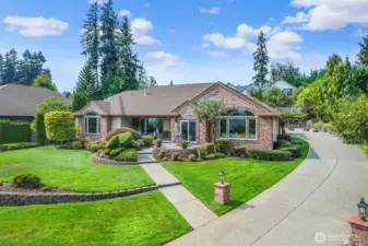 Private driveway to huge 3 car garage. And grand paved parking area for a motorhome with dedicated power.