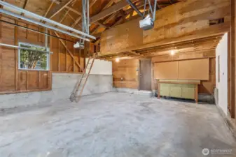 Truly a 2 car garage with EV charger and a huge loft space above