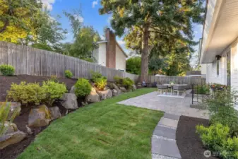 Beautiful landscaped yard with new and mature plantings.