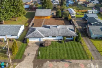 Large lot size with back-alley access to the detached 34'x30' commercial quality shop.