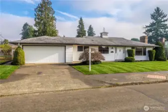 Attached 480sf 2-car garage includes built-in storage space.