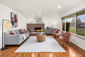 Enter to the stunning main living area, complete with refinished original hardwood floors and bright picturesque windows.