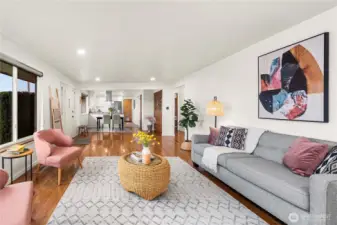 The open concept living area flows seamlessly into the dining and kitchen areas.