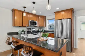 Newer appliances, granite counters, and solid wood cabinetry