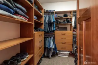 Primary bedroom custom built in walk in closet