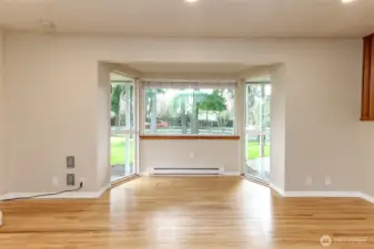 Natural light floods the living area and provides beautiful views of your front yard and mature landscaping.