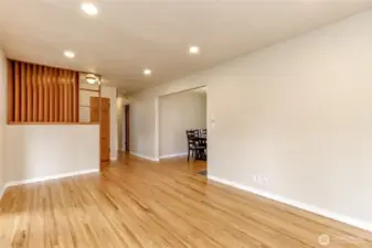 Hardwood floors extend into the dining room, hallway and three bedrooms.
