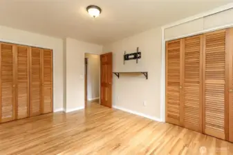 Double closets in primary bedroom. All rooms have solid hardwood doors and wood closet doors too.