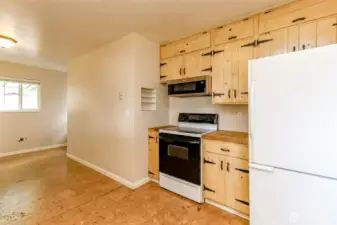 Plenty of room for a nice shelving unit or a bar with stools against the kitchen wall or under window.