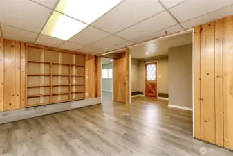 Built in display shelves in the family room. Ceiling tiles can be removed if you prefer a higher ceiling.