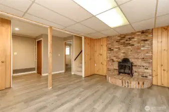 Electric fireplace takes the place of the pellet stove that sat on this beautiful brick, can be changed out if you prefer.