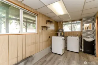 Huge utility room downstairs has a built-in desk that you can't see in photo along with under stair storage.
